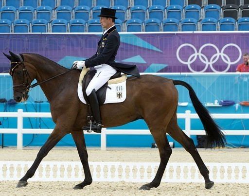 Germany&#039;s Dirk Schrade on King Artus competes in the dressage event
