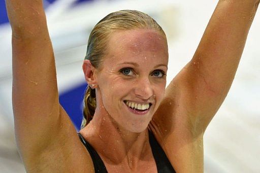 US swimmer Dana Vollmer celebrates after breaking the world record