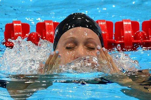 Dana Vollmer celebrates after breaking the world record
