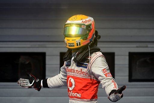 Lewis Hamilton celebrates in the parc ferme