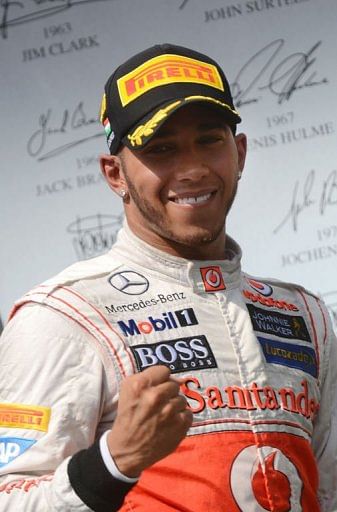 Lewis Hamilton celebrates on the podium