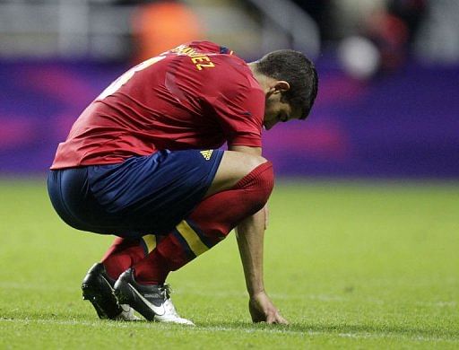 Spain&#039;s Alvaro Dominguez reacts after losing 1-0 to Honduras