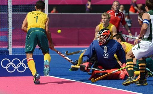 Australia&#039;s Jamie Dwyer scores one of his three goals against South Africa on Monday