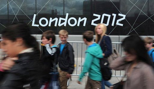 Visitors walk to the London 2012 Olympic Park in east London on day 3 of the 2012 London Olympic Games