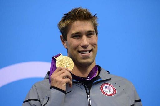 US swimmer Matthew Grevers poses on the podium with the gold medal