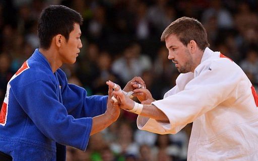 Britain&#039;s Colin Oates (right) competes with Korea&#039;s Cho Jun-Ho