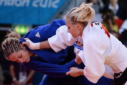 France&#039;s Automne Pavia (white) competes with Britain&#039;s Sarah Clark (blue)
