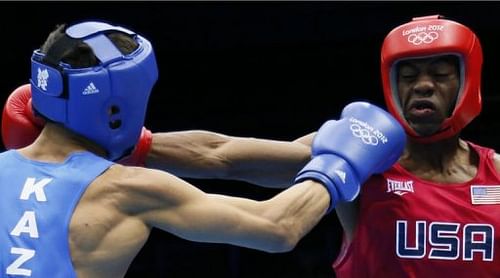 Jamel Herring (R) of the USA exchanges blows with Daniyar Yeleussinov (L) of Kazakhstan