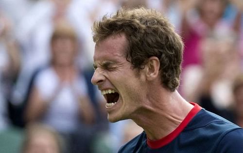 Britain's Andy Murray celebrates after defeating Cyprus' Marcos Baghdatis