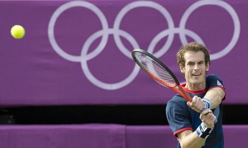 Britain's Andy Murray returns a shot to Cyprus' Marcos Baghdatis