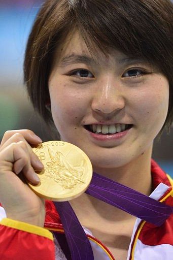 China&#039;s gold medalist Jiao Liuyang poses on the podium