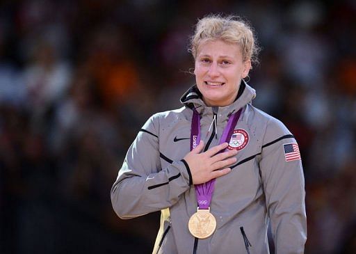 United States&#039; gold medalist Kayla Harrison reacts on the podium o