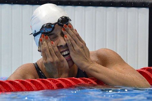 Netherlands&#039; Ranomi Kromowidjojo celebrates her gold medal