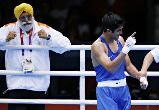 Vijender Singh (R) of India is declared winner over Terrell Gausha of the USA