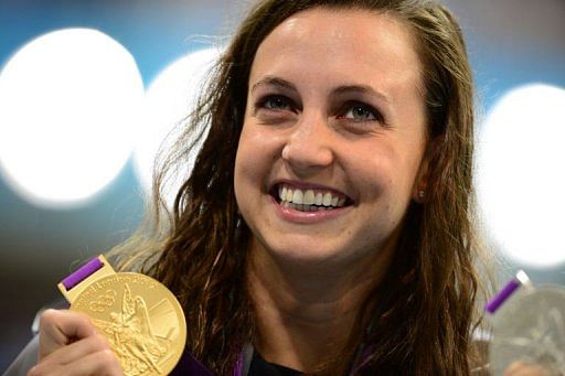 US swimmer Rebecca Soni shows off her gold medal