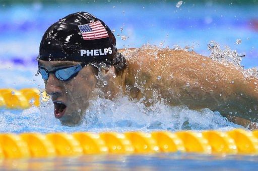US swimmer Michael Phelps competes in the men&#039;s 100m butterfly final