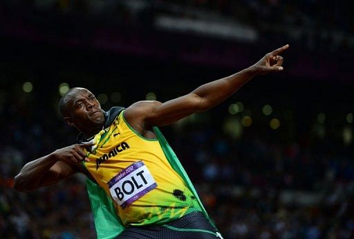Jamaica&#039;s Usain Bolt celebrates after winning the men&#039;s 100m final