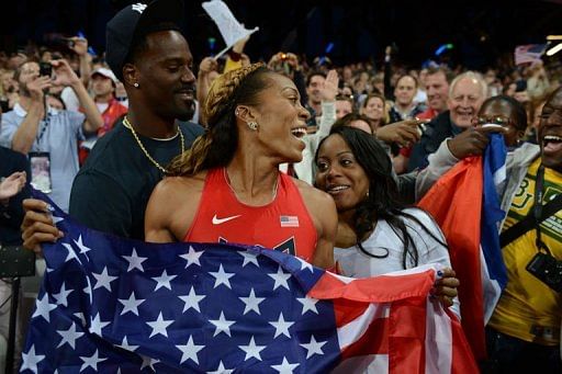 USA&#039;s Sanya Richards-Ross poses with her husband American football player Aaron Ross (L)