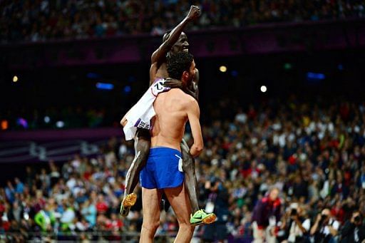 Kenya&#039;s Ezekiel Kemboi (L) and France&#039;s Mahiedine Mekhissi-Benabbad celebrate