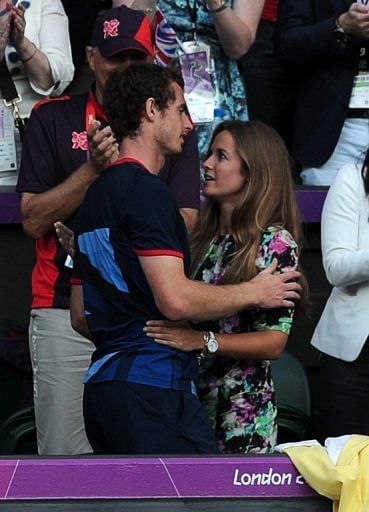 Andy Murray hugs his girlfriend Kim Sears after winning his first Olympic gold medal with a demolition of Roger Federer