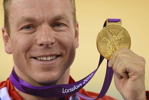 Great Britain&#039;s Chris Hoy poses on the podium after winning the gold medal