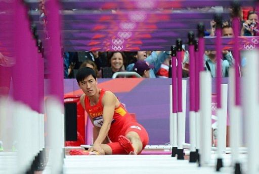 China&#039;s Liu Xiang reacts after falling while competing in the men&#039;s 110m hurdles heats