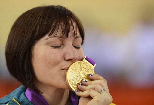 Australia&#039;s Anna Meares celebrates on the podium after winning the gold medal