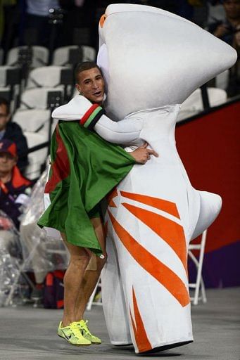 Algeria&#039;s Taoufik Makhloufi hugs Wenlock the Olympic mascot