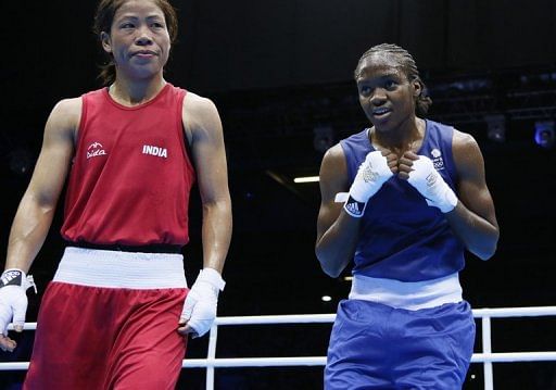 M.C. Mary Kom (left) stands in the ring following her loss to Nicola Adams
