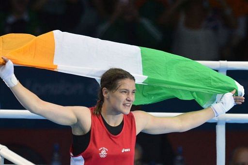 Katie Taylor of Ireland celebrates defeating Sofya Ochigava of Russia t