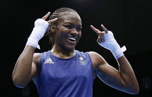 Nicola Adams of Great Britain celebrates her gold medal victory over Cancan Ren of China