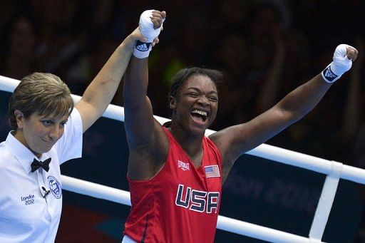 Claressa Shields of the USA celebrates defeating Nadezda Torlopova of Russia to win gold