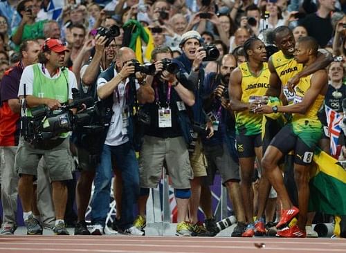 Jamaica's Usain Bolt (C) celebrates with Yohan Blake (L) and Warren Weir