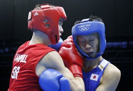 Luke Campbell of Great Britain (in red) fights against Satoshi Shimizu of Japan