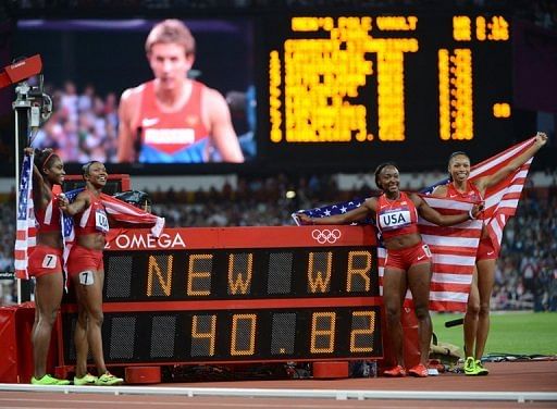 USA&#039;s Tianna Madison, Carmelita Jeter, Bianca Knight and Allyson Felix celebrate winning the women&#039;s 4x100m relay final