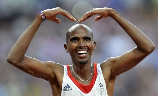 Britain&#039;s Mohamed Farah celebrates after winning the men&#039;s 5000m