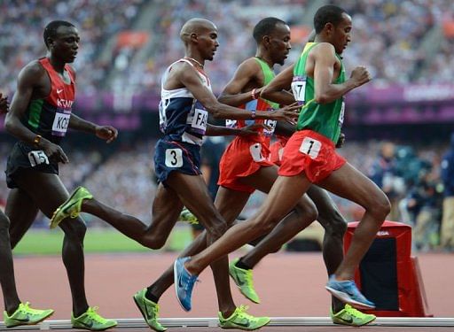 Britain&#039;s Mohamed Farah (C) competes in the men&#039;s 5000m final