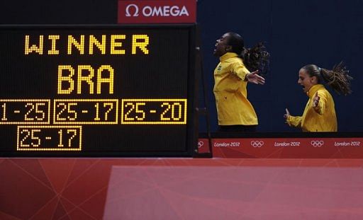 Brazil&#039;s players celebrate after winning the gold medal by defeating the US in the women&#039;s volleyball gold medal match