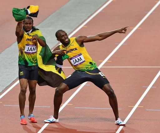 Jamaica&#039;s Usain Bolt (R) and Jamaica&#039;s Yohan Blake celebrate after winning the men&#039;s 4x100 relay
