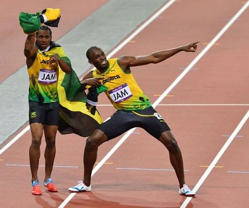 Jamaica's Usain Bolt (R) and Jamaica's Yohan Blake celebrate after winning the men's 4x100 relay