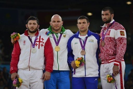 L-R: Georgia&#039;s Davit Modzmanashvili, Uzbekistan&#039;s Artur Taymazov, Iran&#039;s Komeil Ghasemi and Russia&#039;s Bilyal Makhov