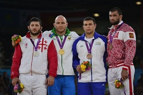 L-R: Georgia's Davit Modzmanashvili, Uzbekistan's Artur Taymazov, Iran's Komeil Ghasemi and Russia's Bilyal Makhov