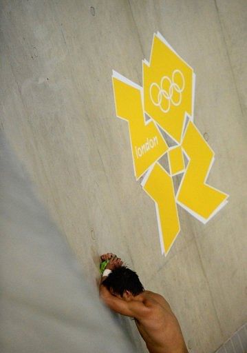 China&#039;s Qiu Bo reacts to his silver medal on Saturday