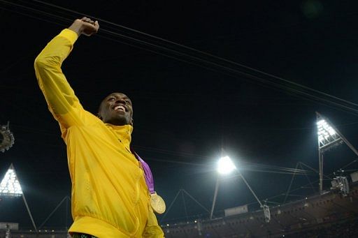 IOC President Rogge hails 'legend' Bolt in bid to quell Olympic row