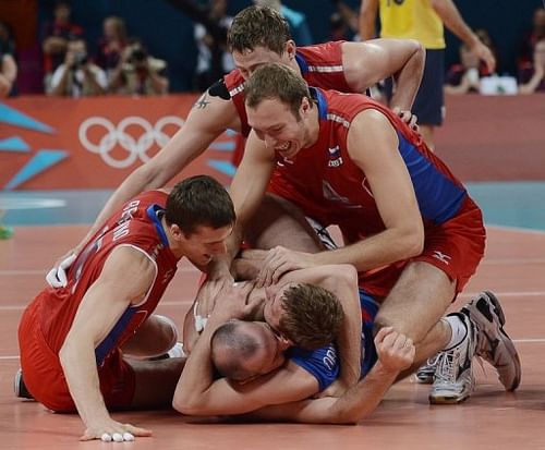 Russia's volleyball champions celebrate their gold medal Russia's volleyball champions celebrate their gold medal