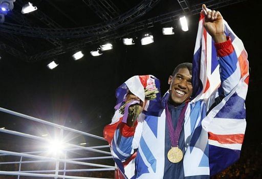 Anthony Joshua of Great Britain celebrates during the awards ceremony