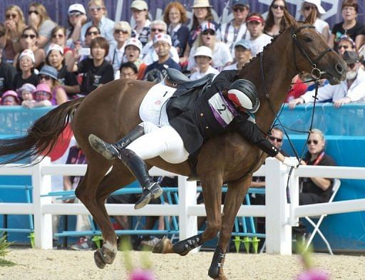 Japan&#039;s Narumi Kurosu loses control of her horse Zafira during the women&#039;s Modern Pentathlon riding show jumping event