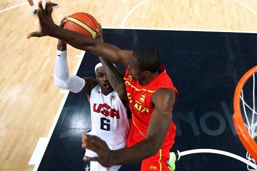 Serge Ibaka (R) of Spain defends against LeBron James (L) of the US d
