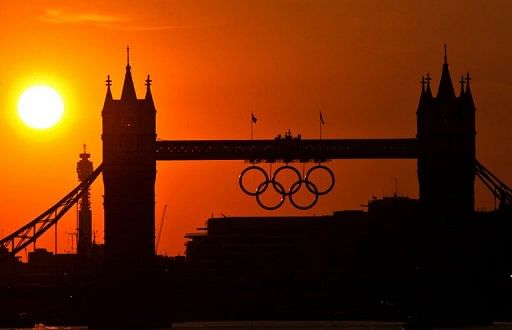 The sun sets behind the 2012 London Olympic Rings on Tower Bridge