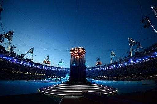 View of the Olympic flame burning in the Olympic stadium prior to the start of the closing ceremony